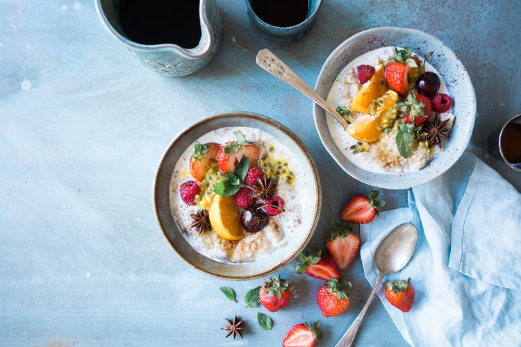 two bowls of healthy oats and fruit