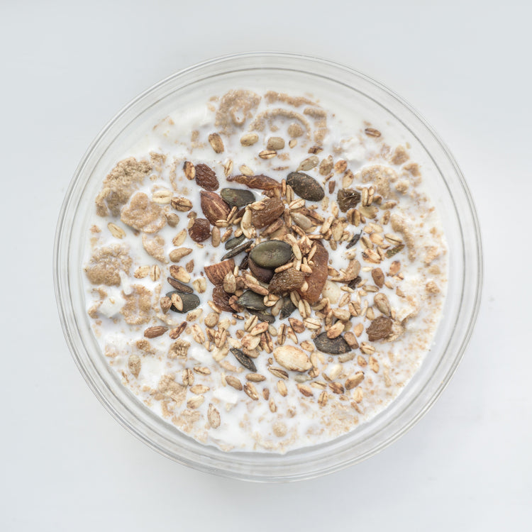 bowl of gluten free oats topped with coffee beans